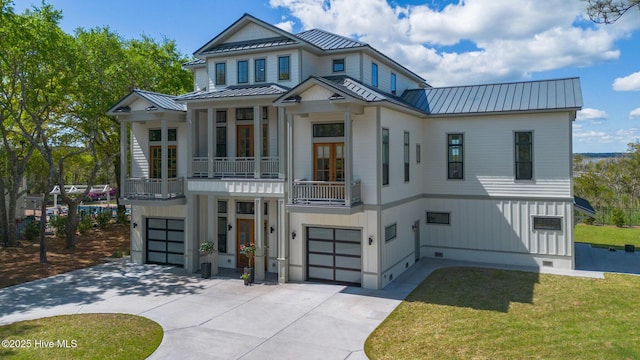 view of front of property featuring a standing seam roof, metal roof, and an attached garage