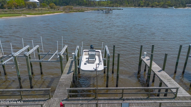 view of dock with a water view and boat lift