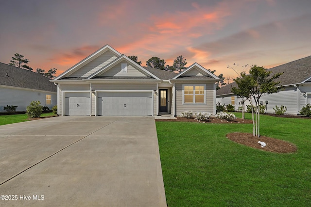 7801 Harrier Cir, Leland, NC 28451 - single story home with an attached garage, a lawn, and concrete driveway