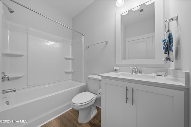 7801 Harrier Cir, Leland, NC 28451 - bathroom featuring vanity, toilet, visible vents, tub / shower combination, and wood finished floors