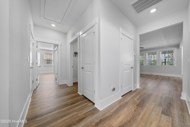 7801 Harrier Cir, Leland, NC 28451 - hallway with wood finished floors, attic access, baseboards, and visible vents