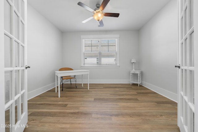 7801 Harrier Cir, Leland, NC 28451 - empty room featuring light wood-style flooring, baseboards, a ceiling fan, and french doors