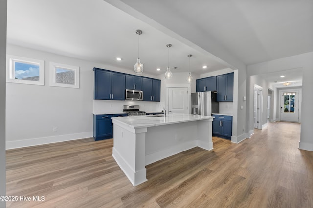7801 Harrier Cir, Leland, NC 28451 - kitchen featuring appliances with stainless steel finishes, blue cabinets, a sink, and recessed lighting