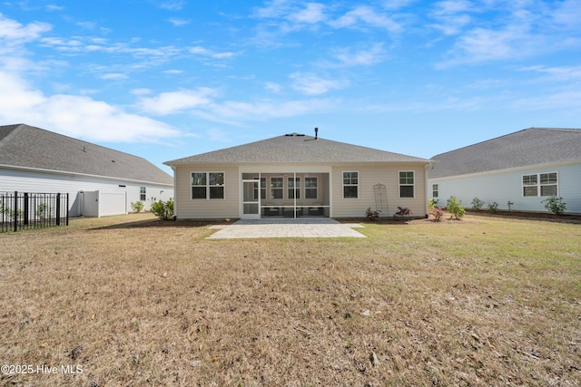 7801 Harrier Cir, Leland, NC 28451 - back of property featuring a patio, fence, and a lawn