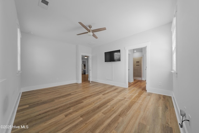 7801 Harrier Cir, Leland, NC 28451 - interior space with light wood-style floors, ceiling fan, baseboards, and visible vents