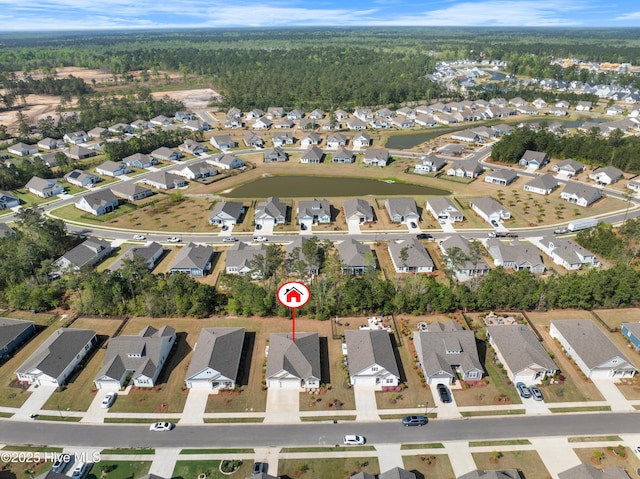7801 Harrier Cir, Leland, NC 28451 - drone / aerial view with a wooded view and a residential view