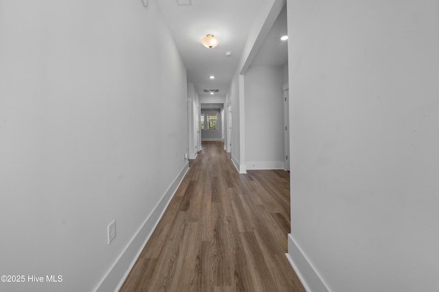7801 Harrier Cir, Leland, NC 28451 - corridor with visible vents, baseboards, and wood finished floors
