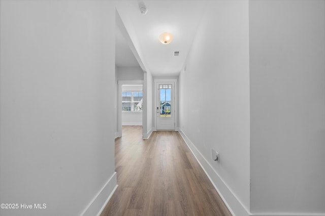 7801 Harrier Cir, Leland, NC 28451 - hallway featuring wood finished floors, baseboards, and visible vents