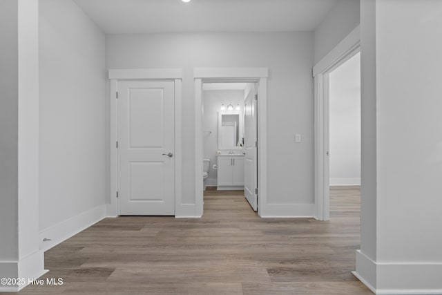 7801 Harrier Cir, Leland, NC 28451 - interior space featuring baseboards, ensuite bath, and wood finished floors