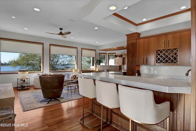 1409 Landfall Dr, Wilmington, NC 28405 - kitchen with a peninsula, open floor plan, a breakfast bar, and recessed lighting