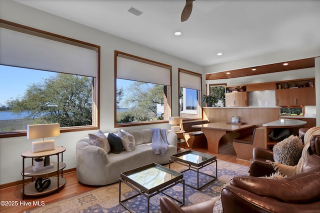 1409 Landfall Dr, Wilmington, NC 28405 - living room featuring light wood-style flooring, recessed lighting, a ceiling fan, and baseboards
