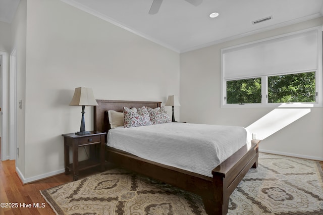 1409 Landfall Dr, Wilmington, NC 28405 - bedroom featuring baseboards, wood finished floors, ornamental molding, and a ceiling fan