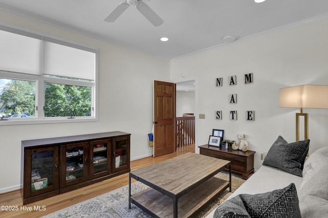 1409 Landfall Dr, Wilmington, NC 28405 - living room with light wood-style flooring, crown molding, ceiling fan, recessed lighting, and baseboards