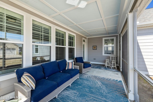 sunroom featuring an outdoor living space