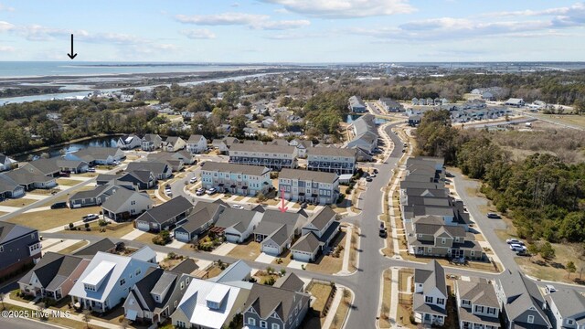 bird's eye view featuring a residential view and a water view