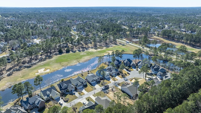 1462 Pinecroft Ln SE, Bolivia, NC 28422 - aerial view of property and surrounding area featuring a local golf course, nearby suburban area, a large body of water, and a heavily wooded area
