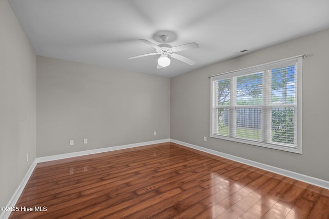 424 Commerce Ave Unit B, Morehead City, NC 28557 - unfurnished room with ceiling fan, baseboards, wood finished floors, and visible vents