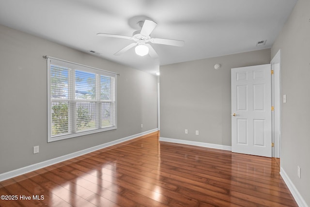 424 Commerce Ave Unit B, Morehead City, NC 28557 - spare room featuring wood finished floors, visible vents, a ceiling fan, and baseboards