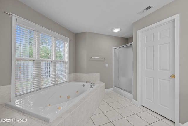 424 Commerce Ave Unit B, Morehead City, NC 28557 - full bathroom with a tub with jets, tile patterned flooring, visible vents, and a shower stall