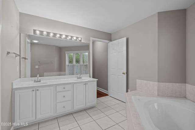 424 Commerce Ave Unit B, Morehead City, NC 28557 - full bathroom featuring double vanity, a garden tub, tile patterned flooring, and a sink