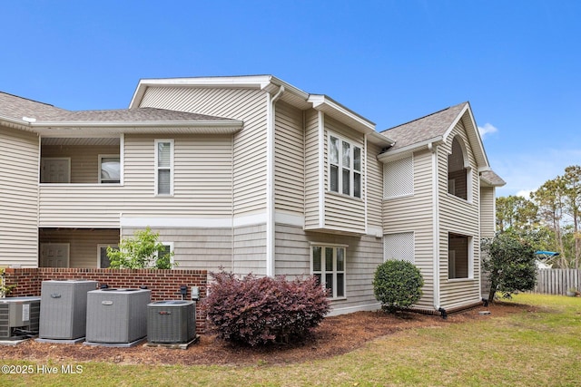 424 Commerce Ave Unit B, Morehead City, NC 28557 - view of side of property with roof with shingles and central air condition unit