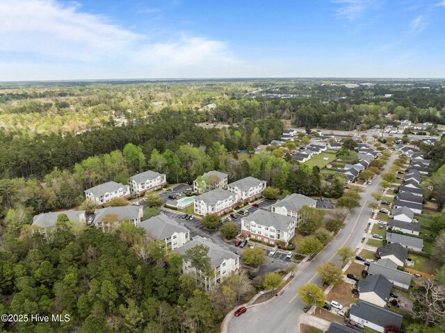bird's eye view featuring a residential view and a view of trees