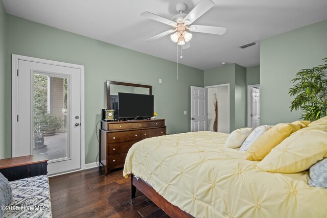 bedroom with baseboards, access to outside, dark wood finished floors, ceiling fan, and visible vents
