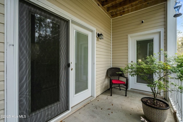 doorway to property with a patio
