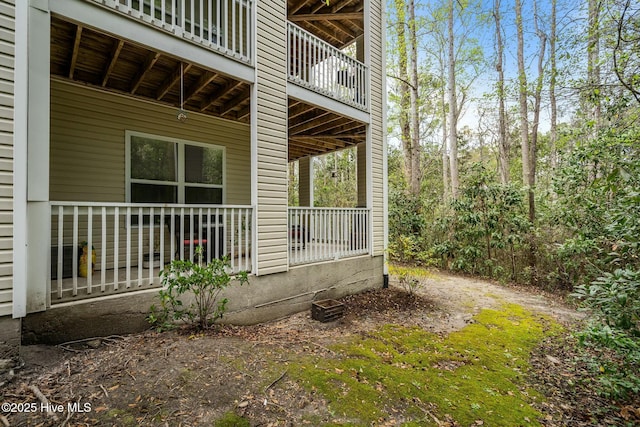 view of side of property with covered porch