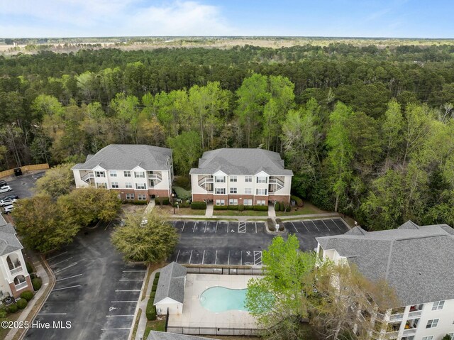 aerial view with a wooded view