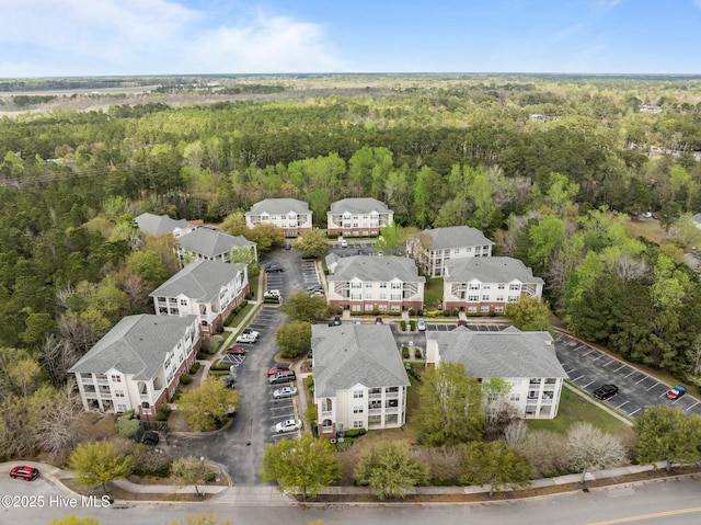 bird's eye view featuring a forest view