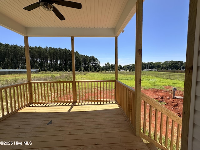 163 Noramac Ct, Selma, NC 27576 - deck featuring a ceiling fan, a yard, and a view of rural / pastoral area