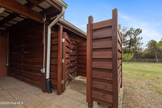 view of outbuilding with fence