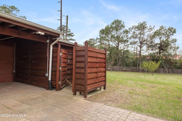 view of outdoor structure featuring fence