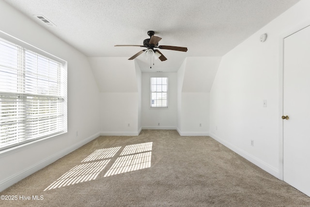 100 Moorefield Dr, Carolina Beach, NC 28428 - additional living space with a ceiling fan, light carpet, and lofted ceiling