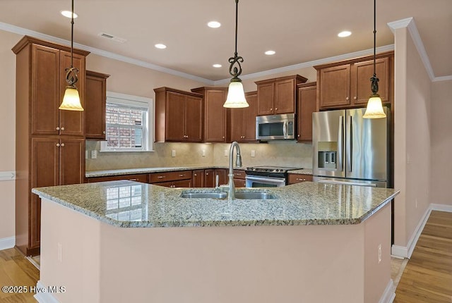 4021 Alastaire Cv, Leland, NC 28451 - kitchen with light wood-style flooring, a sink, tasteful backsplash, visible vents, and appliances with stainless steel finishes