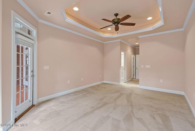 4021 Alastaire Cv, Leland, NC 28451 - unfurnished room featuring ceiling fan, a tray ceiling, light colored carpet, and crown molding