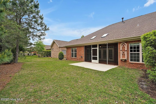 4021 Alastaire Cv, Leland, NC 28451 - rear view of property featuring brick siding, a patio area, a lawn, and a shingled roof