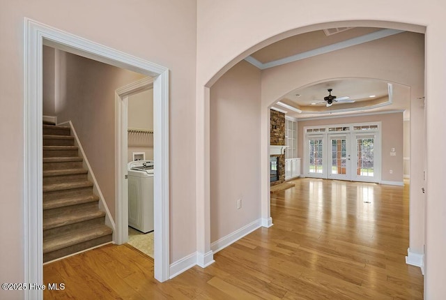 4021 Alastaire Cv, Leland, NC 28451 - hall with baseboards, crown molding, light wood-style floors, and a raised ceiling