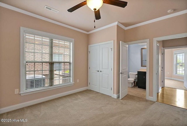 4021 Alastaire Cv, Leland, NC 28451 - unfurnished bedroom featuring visible vents, a ceiling fan, ornamental molding, light carpet, and baseboards