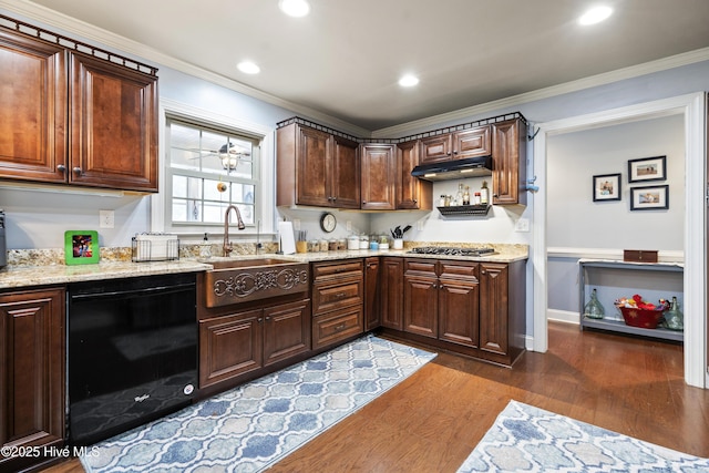 211 E 11th St, Southport, NC 28461 - kitchen with black dishwasher, under cabinet range hood, dark wood-style floors, a sink, and crown molding