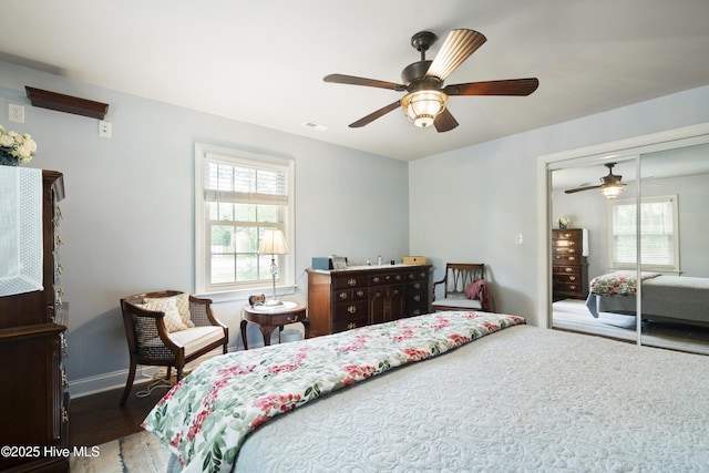 211 E 11th St, Southport, NC 28461 - bedroom with wood finished floors, a closet, baseboards, and ceiling fan