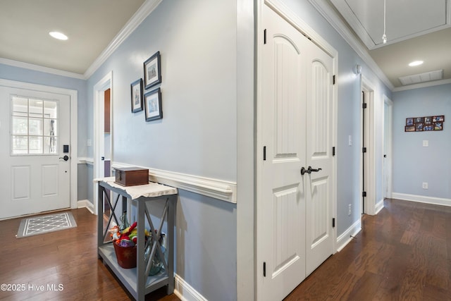 211 E 11th St, Southport, NC 28461 - hall featuring attic access, dark wood-type flooring, baseboards, recessed lighting, and crown molding