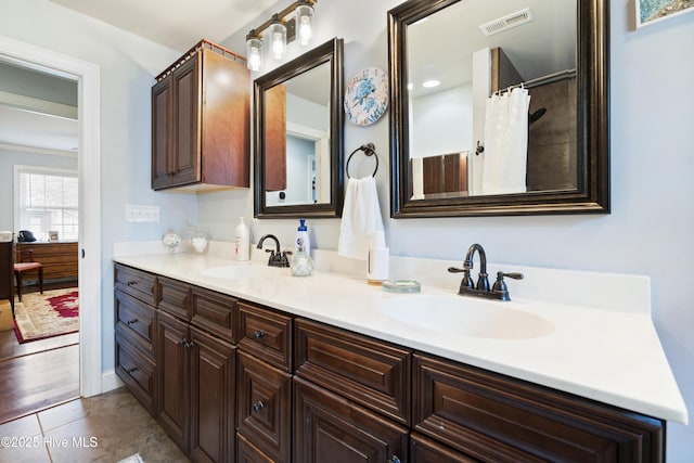 211 E 11th St, Southport, NC 28461 - bathroom featuring double vanity and a shower with shower curtain