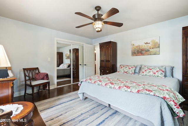 211 E 11th St, Southport, NC 28461 - bedroom with wood finished floors, a closet, baseboards, and a ceiling fan