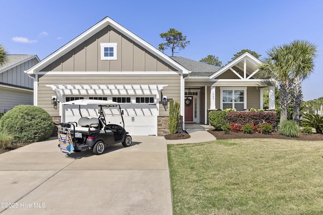 1443 Ellsworth Dr SW, Ocean Isle Beach, NC 28469 - craftsman-style house with concrete driveway, an attached garage, board and batten siding, a front yard, and covered porch