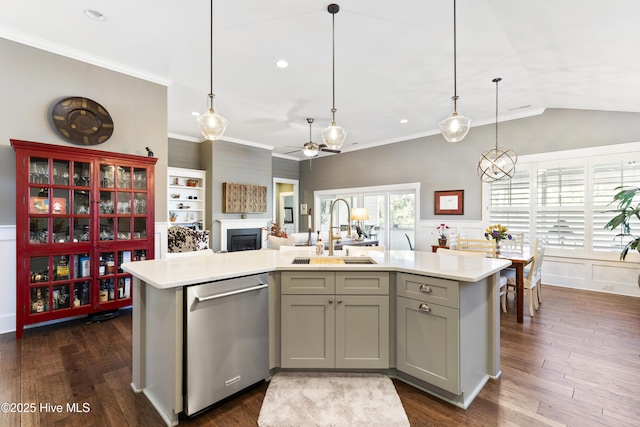1443 Ellsworth Dr SW, Ocean Isle Beach, NC 28469 - kitchen featuring stainless steel dishwasher, a sink, gray cabinets, ceiling fan, and an island with sink