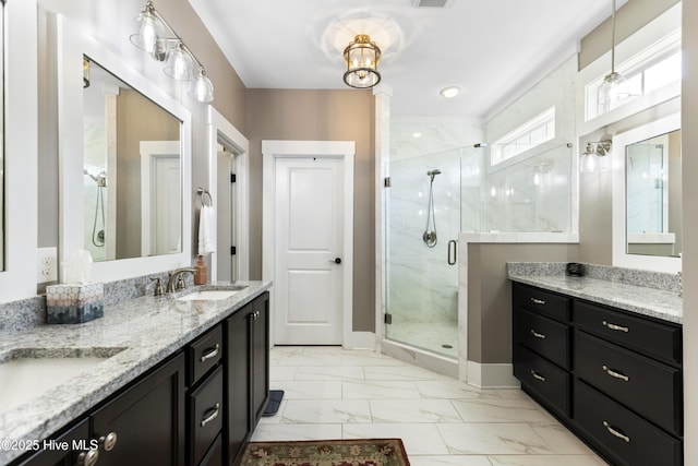 1443 Ellsworth Dr SW, Ocean Isle Beach, NC 28469 - bathroom featuring marble look tiles, a stall shower, double vanity, and baseboards