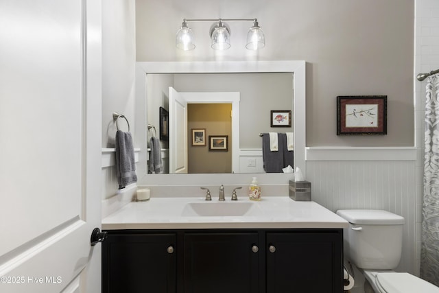1443 Ellsworth Dr SW, Ocean Isle Beach, NC 28469 - bathroom with wainscoting, toilet, and vanity