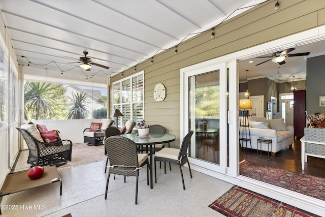 1443 Ellsworth Dr SW, Ocean Isle Beach, NC 28469 - sunroom / solarium featuring ceiling fan, outdoor dining space, wooden walls, and an outdoor living space